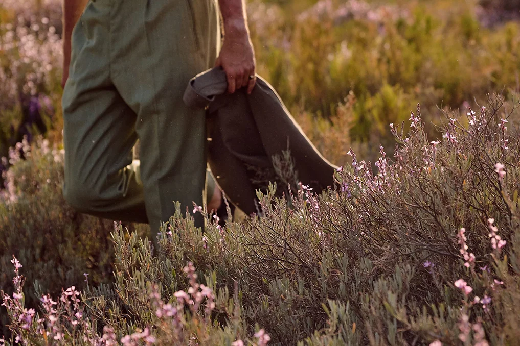 Person walking through native wildflowers